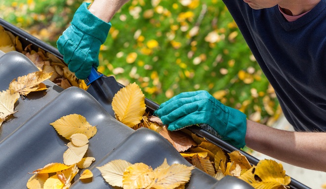 man-cleaning-gutters